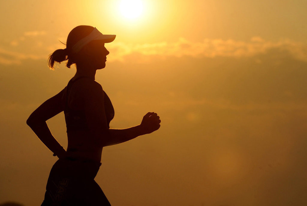 Endurance and Exercise - Female Jogging at Sunset